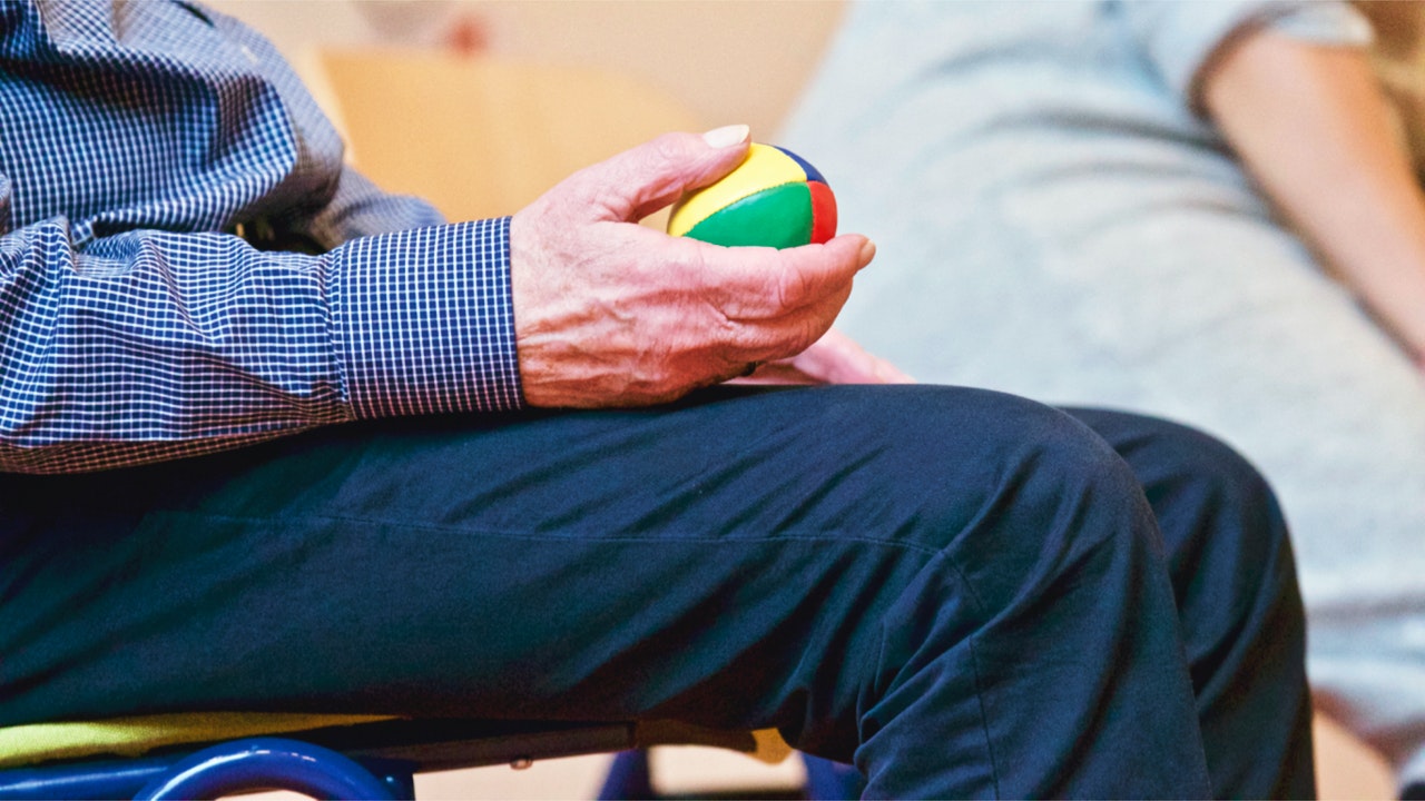 elderly man at therapy at nursing home