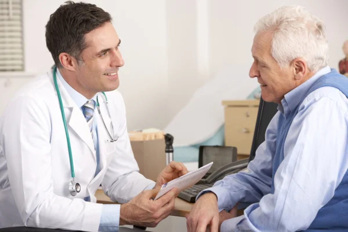 Senior man at a doctor's office talking to doctor